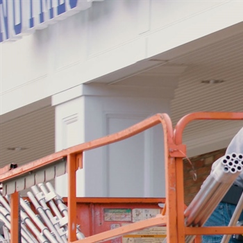 Ian Howard from Advanced Welding installing AceClamp Snow Rail System.