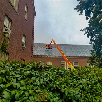Efficient snow retention system shown as metal roof snow bars, chosen by SUNY College