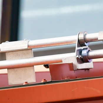 Close-up of pre-assembled AceClamp metal roof ice guards