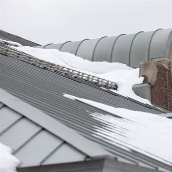 Secure installation of AceClamp snow bars preventing snow avalanches