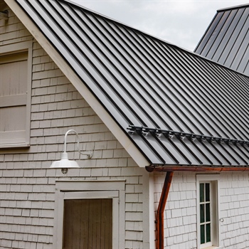 AceClamp 2-Bar metal roof snow stops, powder coated and installed on a powder-coated metal roof in Enfield, CT.