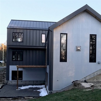 Hunter's Hollow protected by AceClamp snow guards for metal roofing