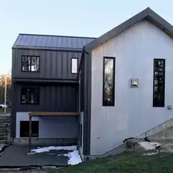 Hunter's Hollow protected by AceClamp snow guards for metal roofing