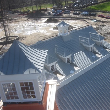 AceClamp snow retention system protecting buildings from dangerous snow and ice avalanches.