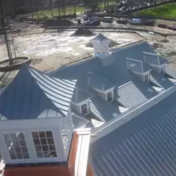 AceClamp snow retention system protecting buildings from dangerous snow and ice avalanches.