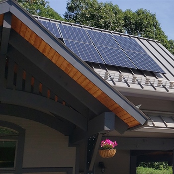 Snow guards on NY Park and Wildlife Department building ensuring safety during heavy snowfall