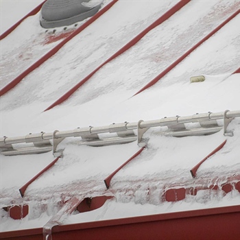 AceClamp’s snow stops for metal roofing at Water Works Car Wash	