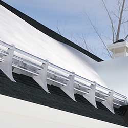 Snow guards for shingle roofs shown in three bar